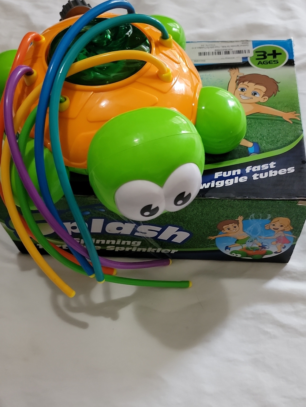 Splash Spinning Tortoise Sprinkler with Multi-Colored Wiggle Tubes